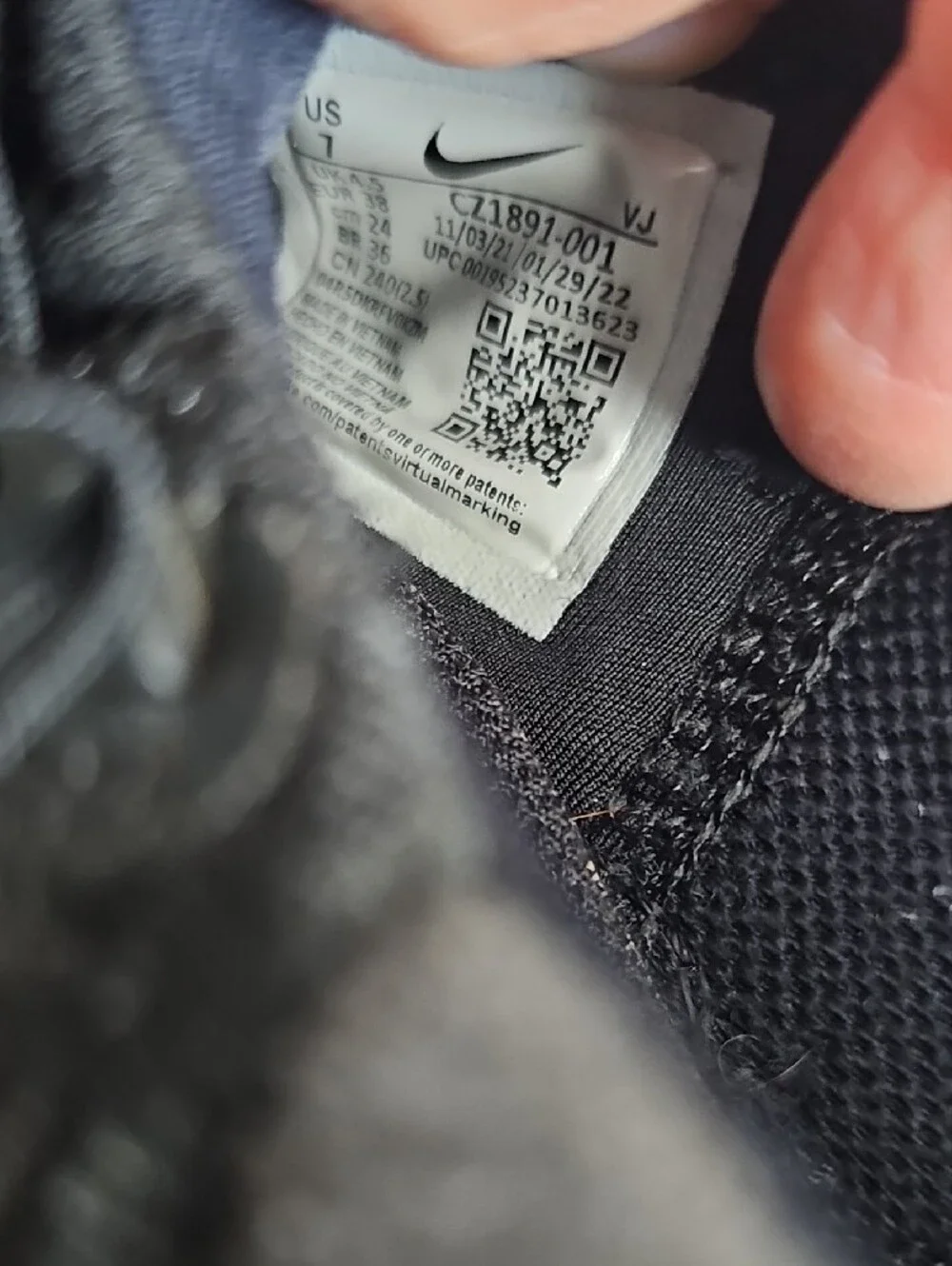 Nike Black Athletic Shoes with White Swoosh